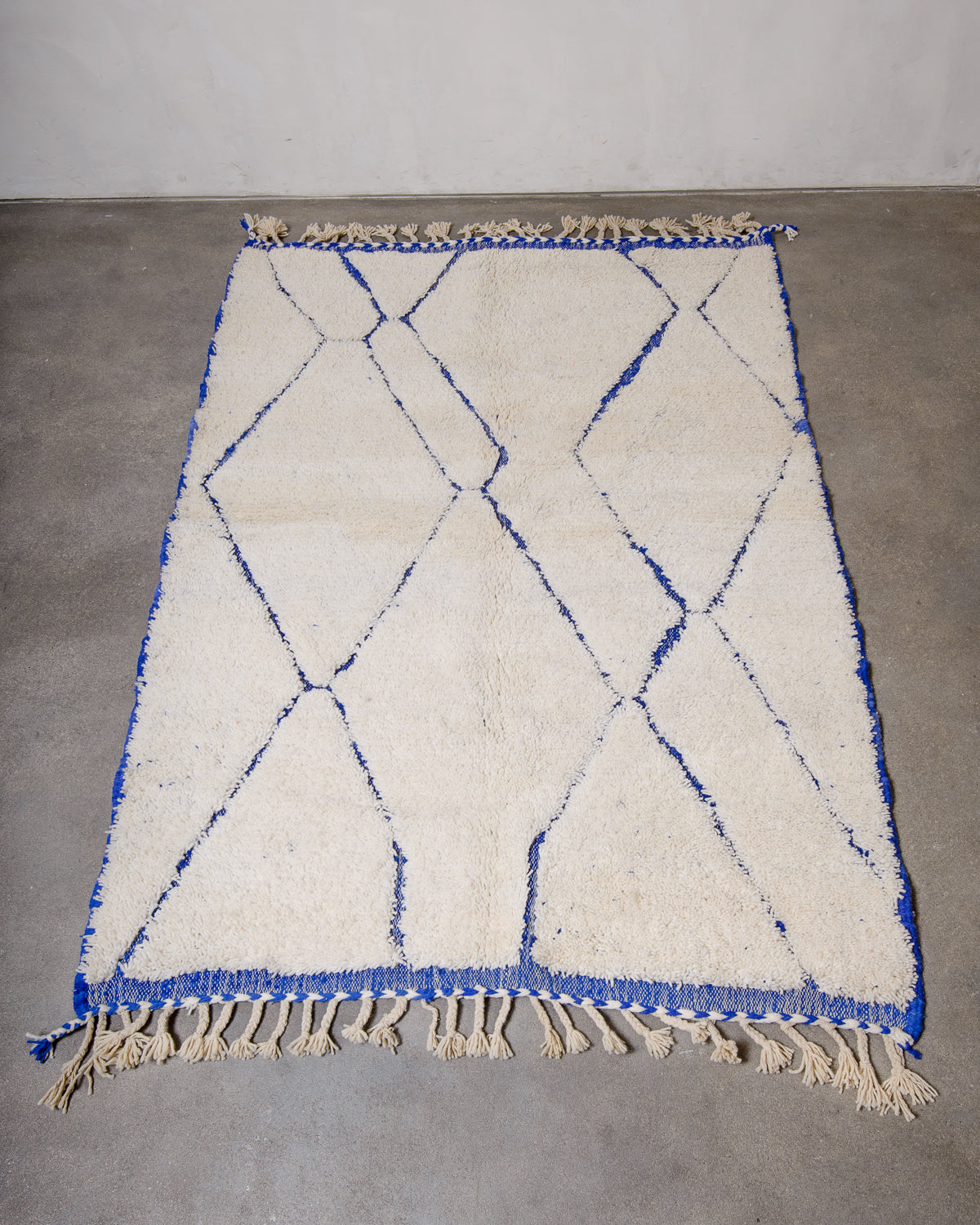 Modern, designer, handcrafted Berber rug from Morocco. Beniourain carpet with minimalist design, natural wool pile and a fluffy texture.